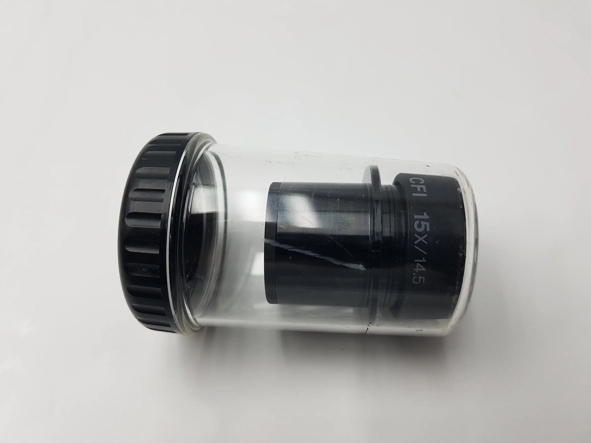 Black 15x nikon microscope eyepiece in clear plastic tube with storage case compatible with nikon microscope systems