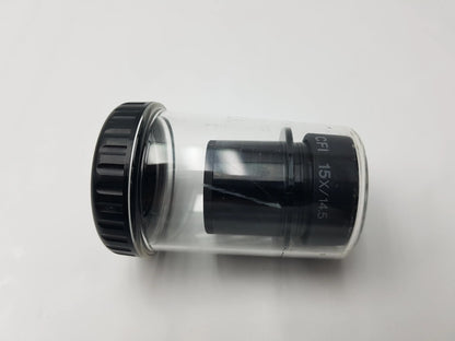 Black 15x nikon microscope eyepiece in clear plastic tube with storage case compatible with nikon microscope systems