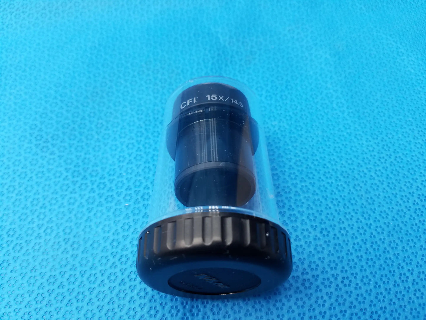 Nikon CFI 15x black cylindrical microscope eyepiece with field number 14.5 in clear protective storage case
