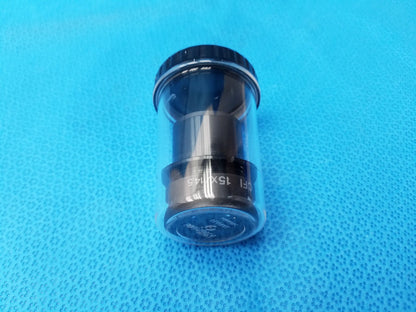 Black cylindrical nikon cfi 15x microscope eyepiece with engraved field number and clear protective storage case