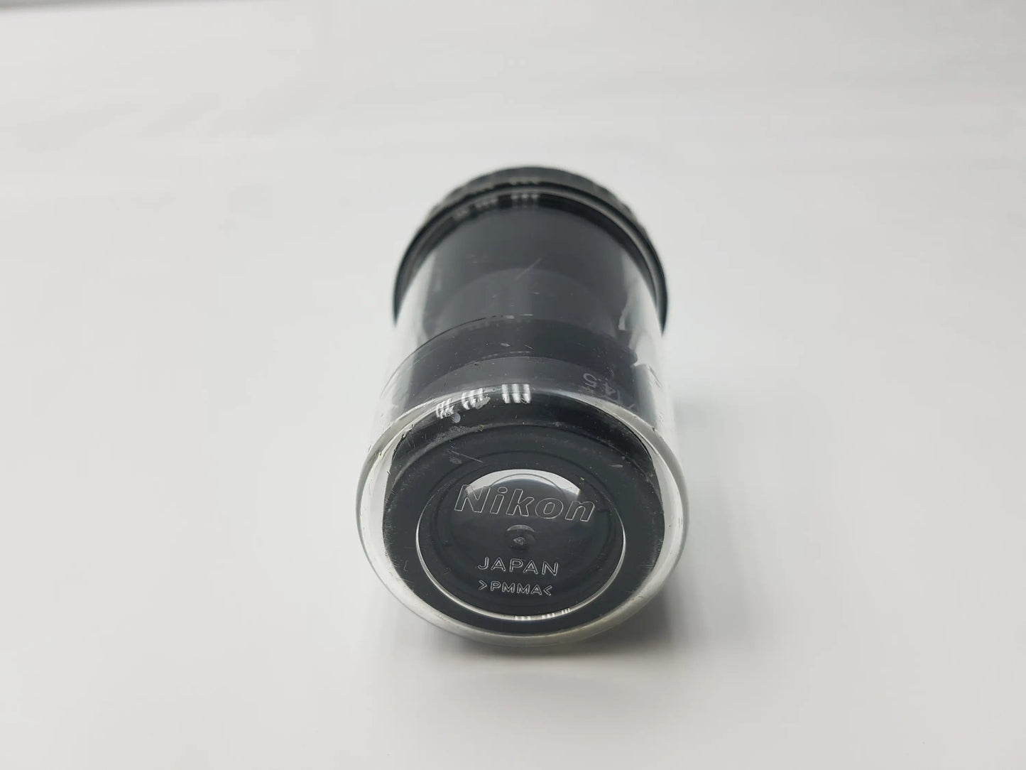 Black Nikon CFI 15x 14.5 microscope eyepiece with clear protective cap marked Japan and Fujinon and storage case compatible Nikon microscope systems