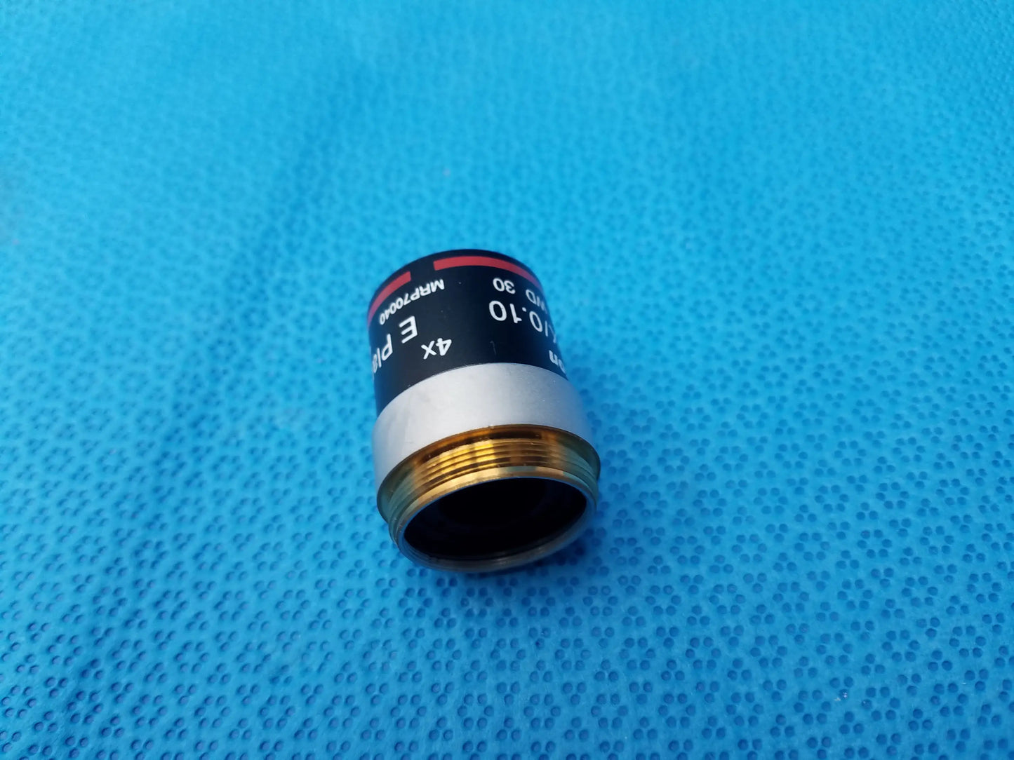 Nikon e plan microscope objective 4x with numerical aperture 0.10 black silver body and gold threading labeled witro