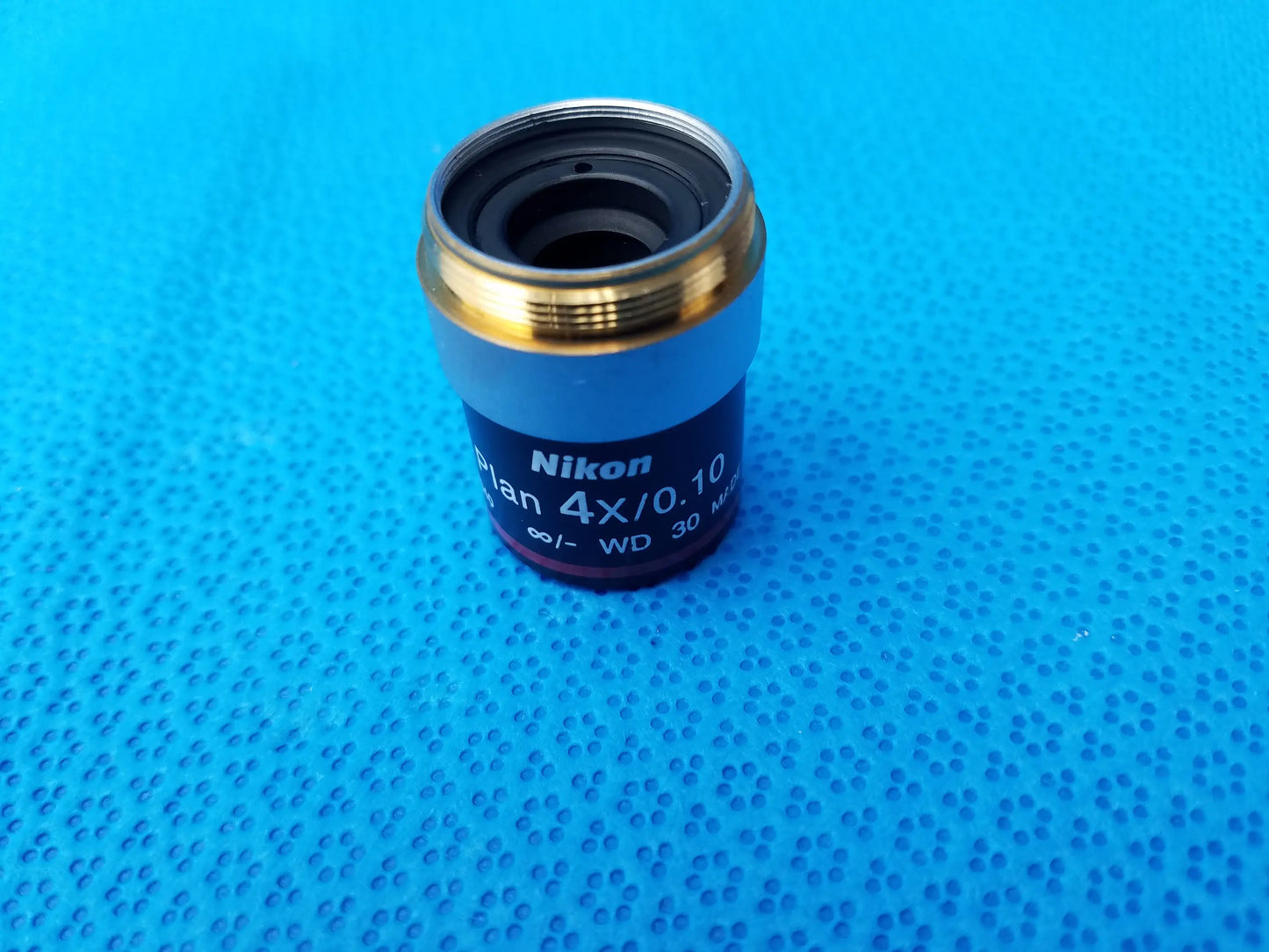 Nikon e plan microscope objective 4x numerical aperture 0.10 with gold rim and blue body for infinity focus and 30mm WD