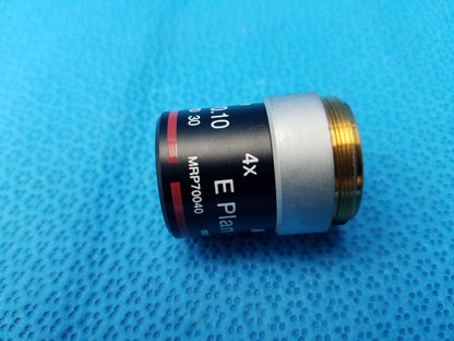 Nikon e plan 4x microscope objective with numerical aperture 0.10 black body silver band and gold threaded mount