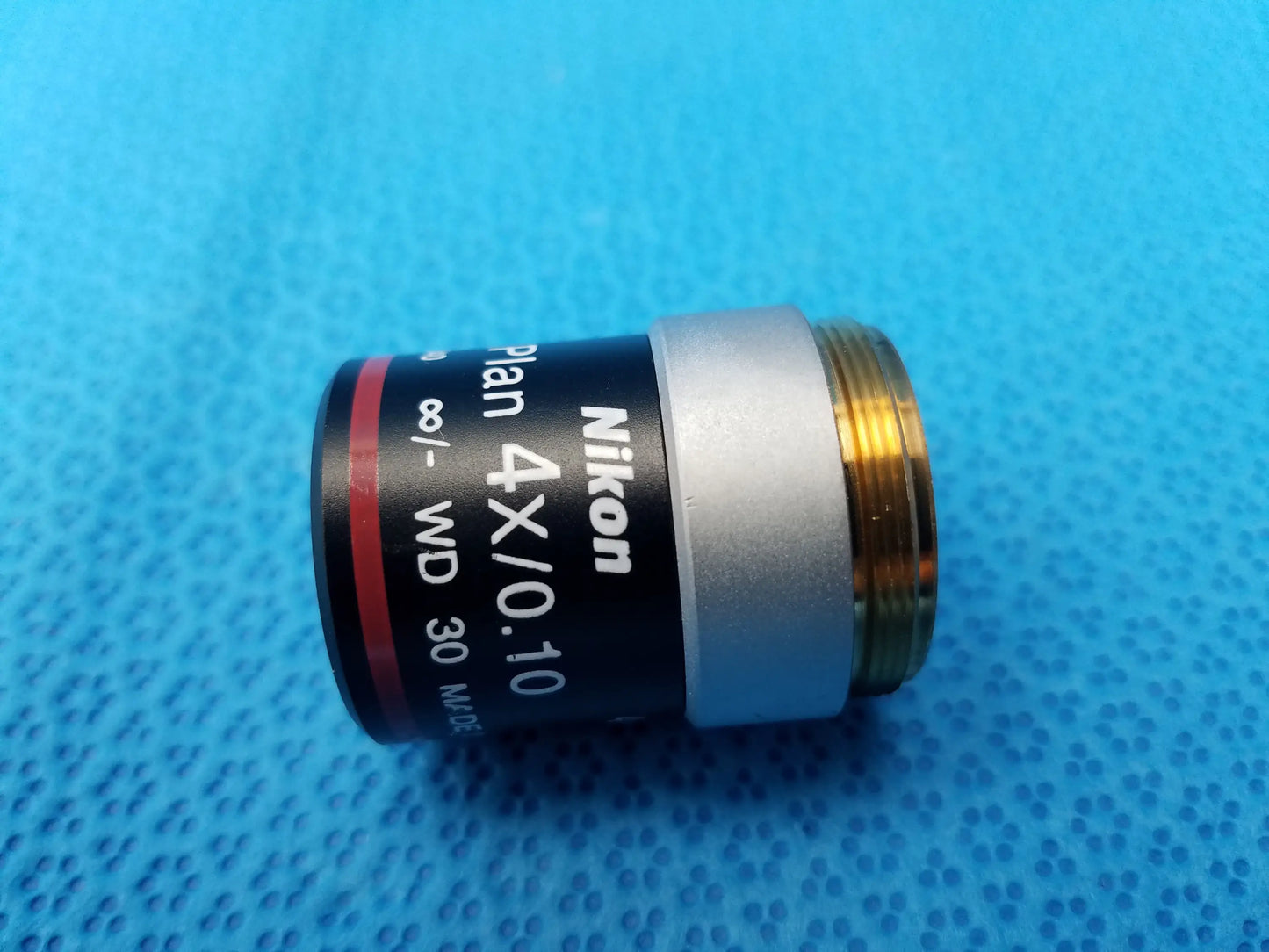 Nikon E Plan microscope objective 4x 0.10 numerical aperture with black silver body and gold-threaded mount