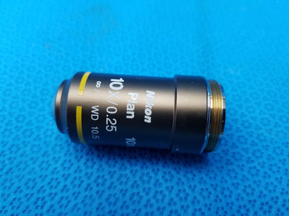 Nikon plan 10x objective lens with black body and gold-colored threading for compatible Nikon microscope systems