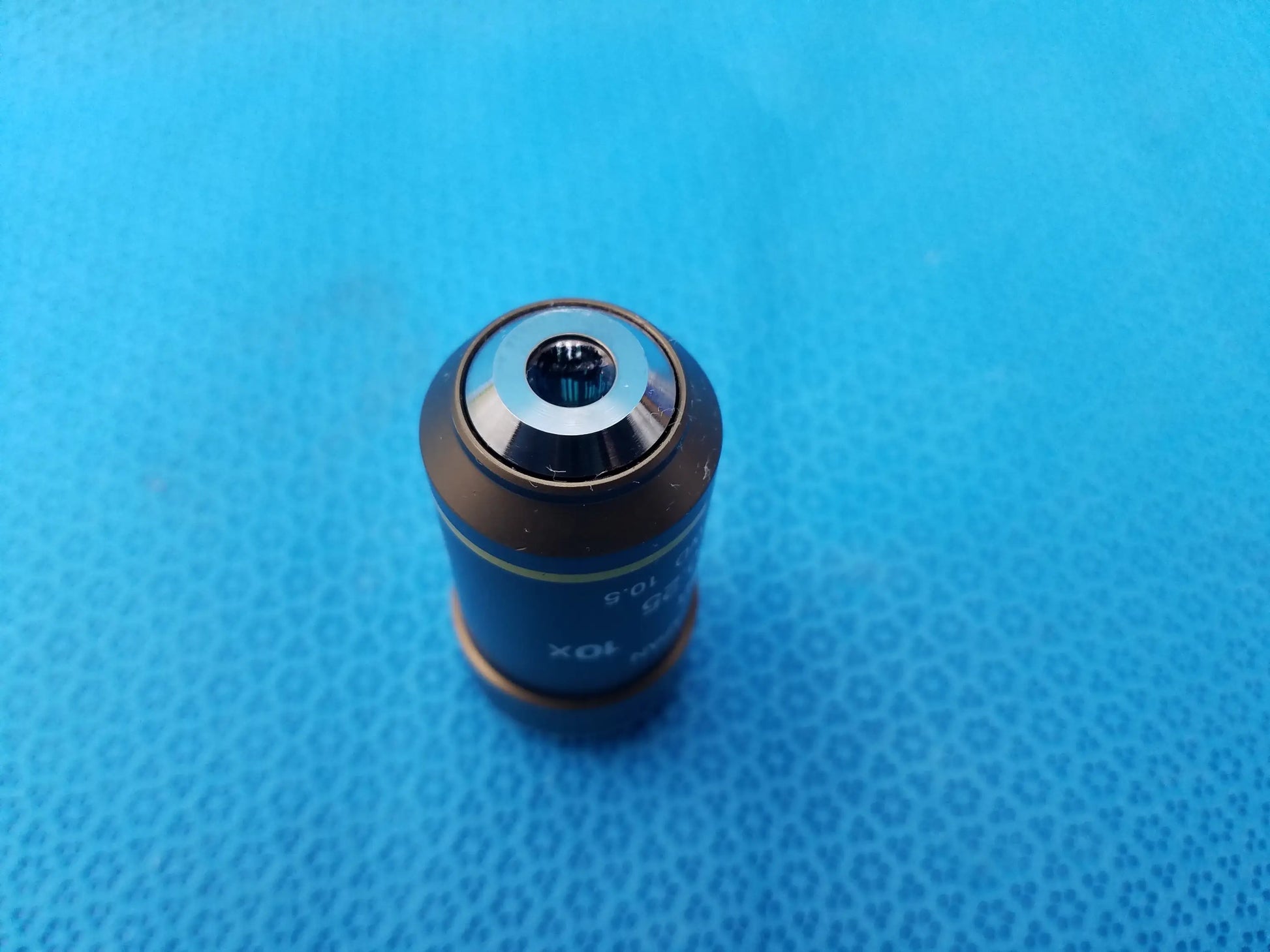 Black and silver metallic Nikon Plan 10X 025 microscope objective lens compatible with Nikon microscope systems