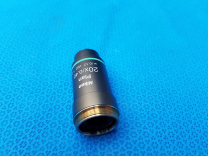 Nikon plan 20x/0.40 microscope objective lens with black body, green ring, and metallic threaded mount for precision use