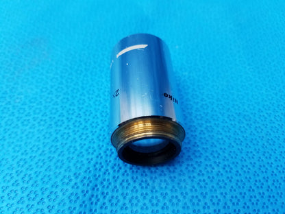 Silver Nikon Plan 2x microscope objective with brass threaded mount compatible with Nikon microscope systems
