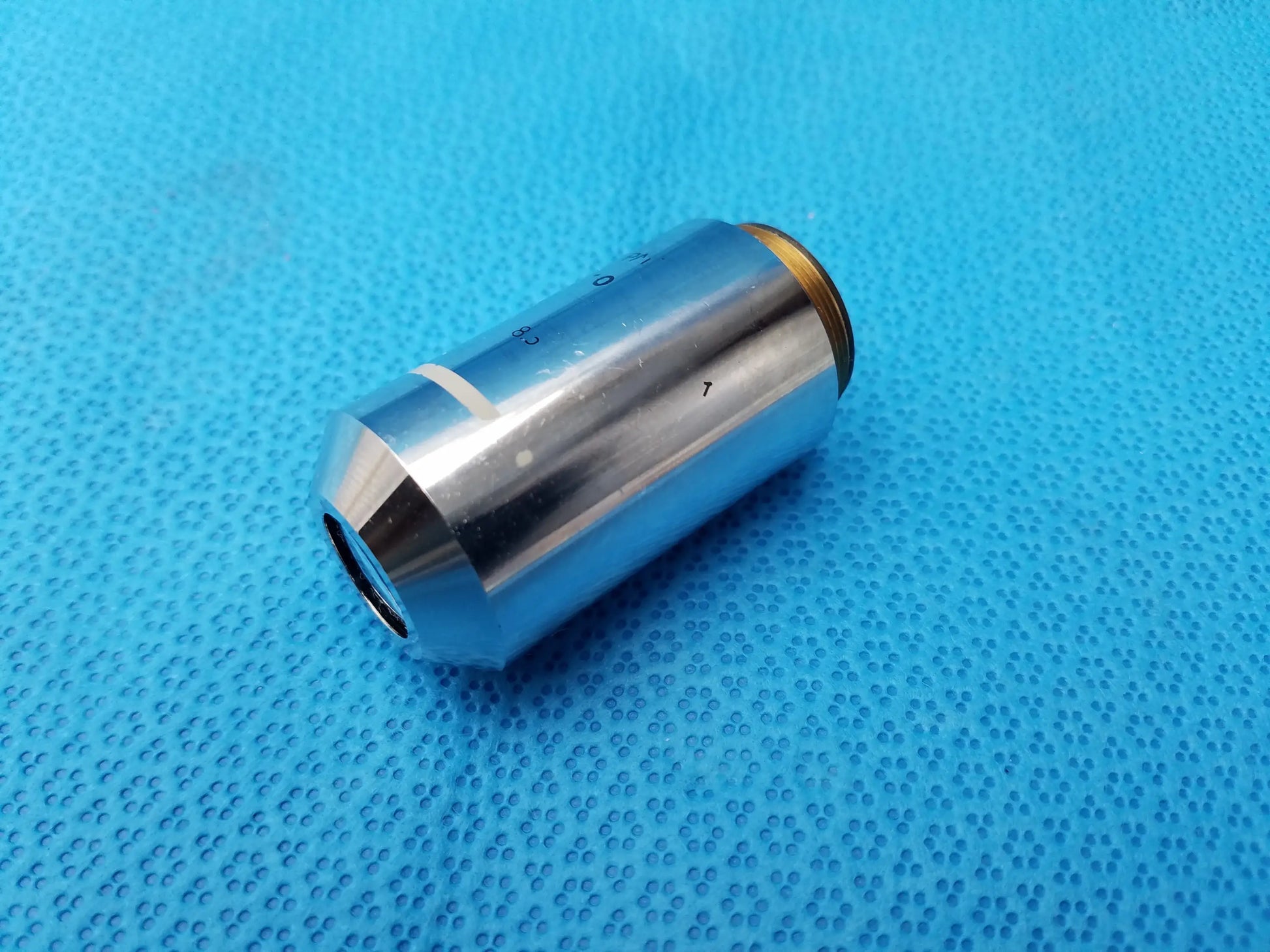 Silver metallic Nikon Plan 2x microscope objective lens with gold threaded mount for compatible Nikon microscope systems