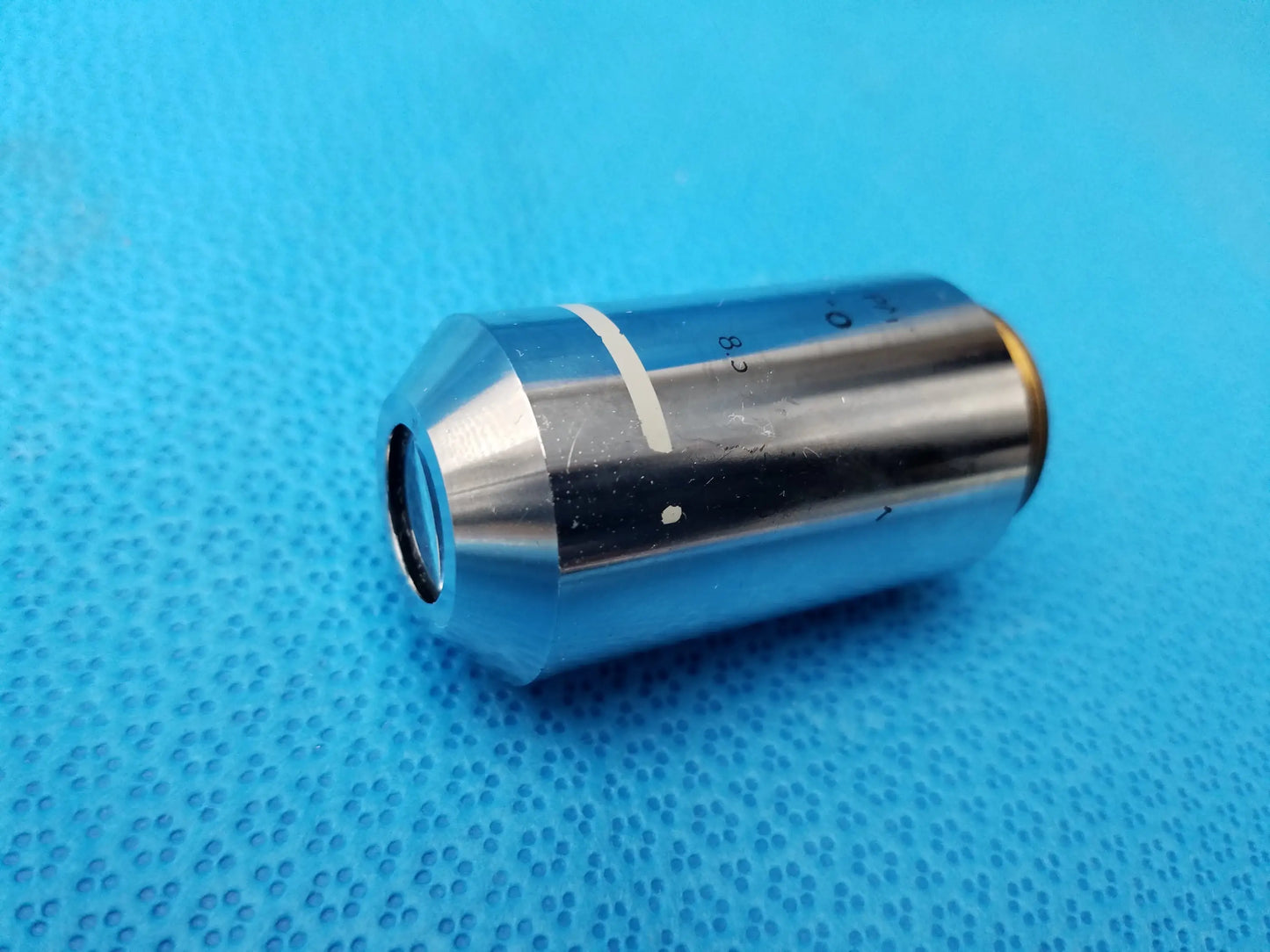 Silver metallic nikon plan 2x microscope objective lens with polished body and gold threaded end for compatible nikon microscope systems