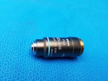 Nikon plan 40x 0.65 microscope objective lens with black body gold threaded mount and blue ring for compatible Nikon microscope systems