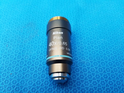 Nikon plan 40x 0.65 black microscope objective lens with gold threaded top engraved for compatible nikon microscope systems