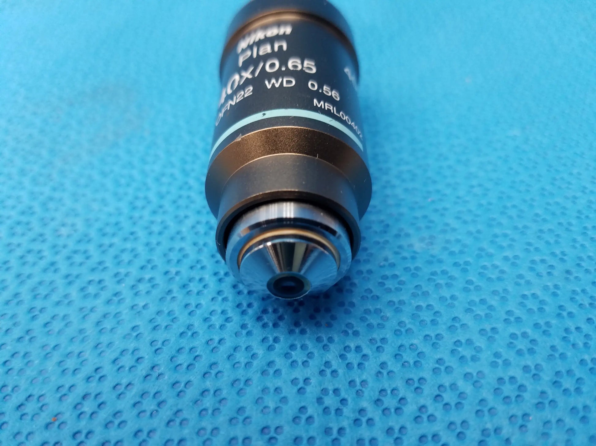 Nikon plan 40x 0.65x metallic microscope objective lens with engraved specs and polished chrome front for compatible Nikon microscope systems