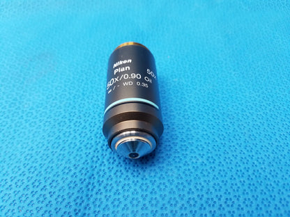 Nikon plan 50x/0.90 oil microscope objective with black body and silver threading for compatible Nikon high-magnification use