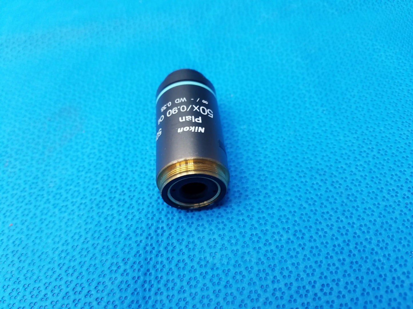 Nikon plan 50x 0.90 microscope objective with black body and gold threaded mount compatible with nikon microscopes