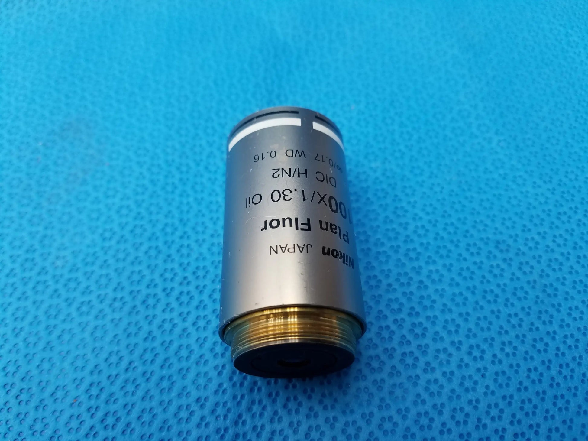 Nikon plan fluor microscope objective with silver metallic body and gold threaded base compatible Nikon Japan model