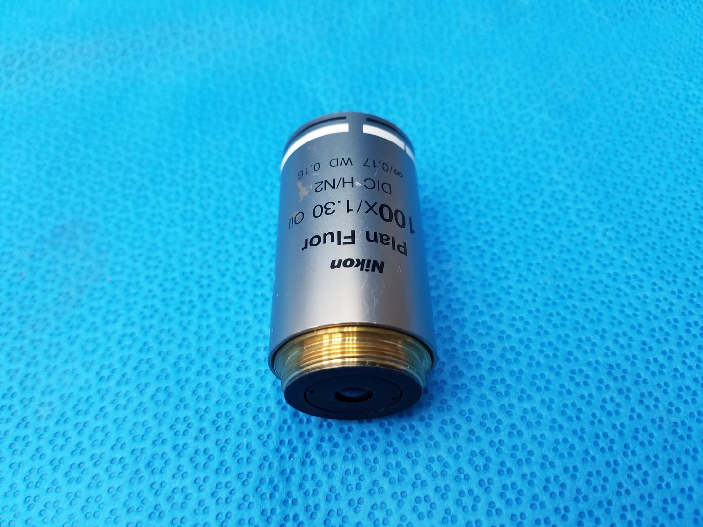 Nikon plan fluor 100x/1.30 oil microscope objective with metallic silver body and gold threaded base compatible Nikon