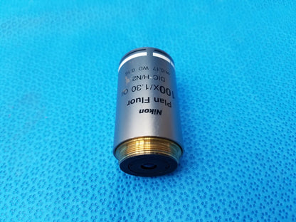 Nikon plan fluor 100x/1.30 oil microscope objective with metallic silver body and gold threaded base compatible Nikon