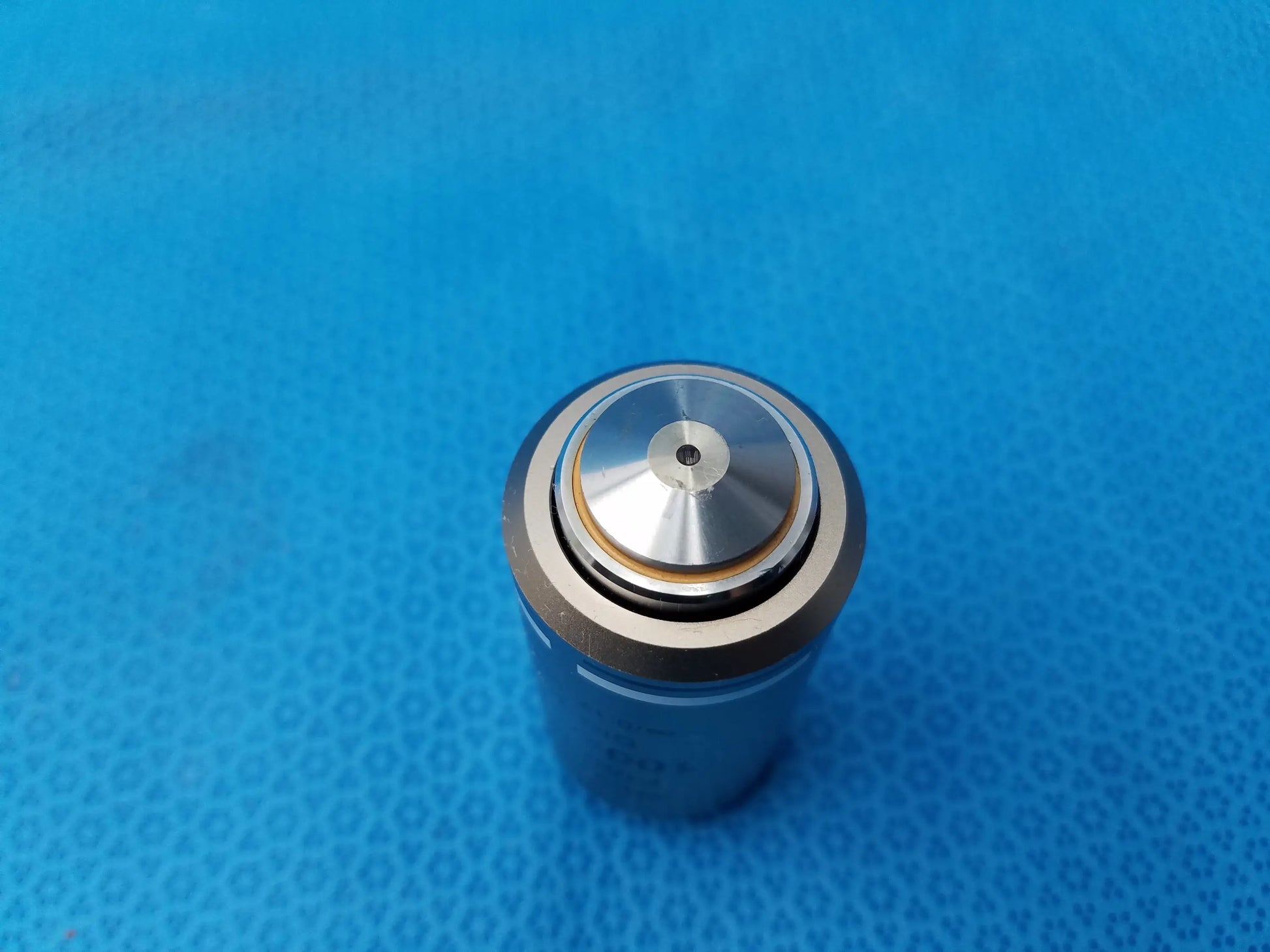 Silver-toned cylindrical microscope objective with polished metallic finish and concentric rings compatible Nikon plan fluor