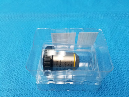 Silver and black nikon plan fluor microscope objective lens with yellow accent band and 16 mm working distance