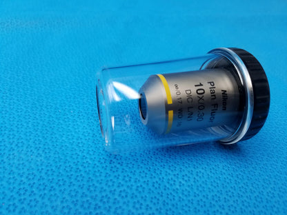 Nikon plan fluor microscope objective lens 10x 0.30 with silver body black cap and working distance 16 in clear housing