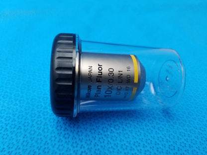 Nikon plan fluor microscope objective 10x 0.30 with 16 mm working distance in clear case with black cap and yellow stripe
