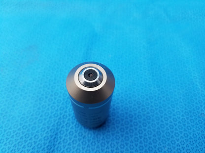 A sleek metallic plan fluor microscope objective with a polished silver top ring compatible with Nikon microscopes