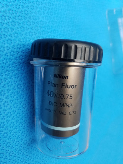 Nikon plan fluor 40x 0.75 dic m n2 microscope objective lens in clear case with black ribbed cap compatible Nikon