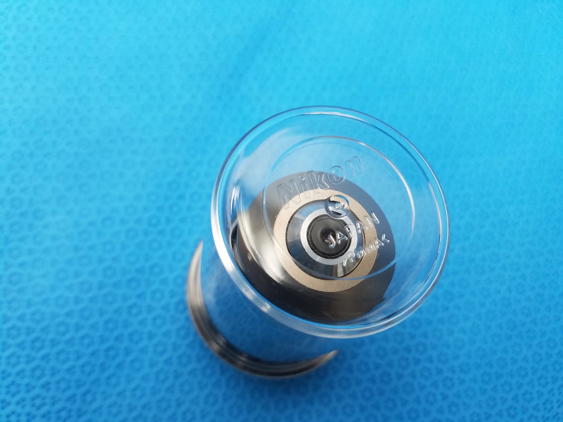 Clear glass lens cap with silver metallic interior engraved nikon japan for plan fluor microscope objective compatible nikon