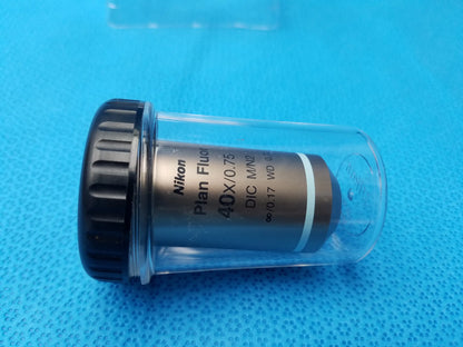 Nikon plan fluor 40x 0.75 microscope objective lens with black knurled cap in clear protective casing compatible Nikon