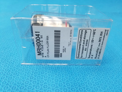 Silver rectangular nikon plan fluor 4x microscope objective lens with white labeling in clear plastic packaging compatible nikon
