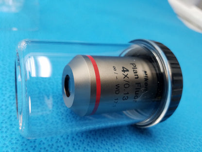 Silver Nikon Plan Fluor 4x/0.13 microscope objective with red ring and black knurled focus collar in clear case compatible Nikon