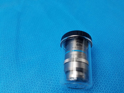 A silver plan fluor 60x microscope objective lens with black top encased in clear packaging compatible nikon model