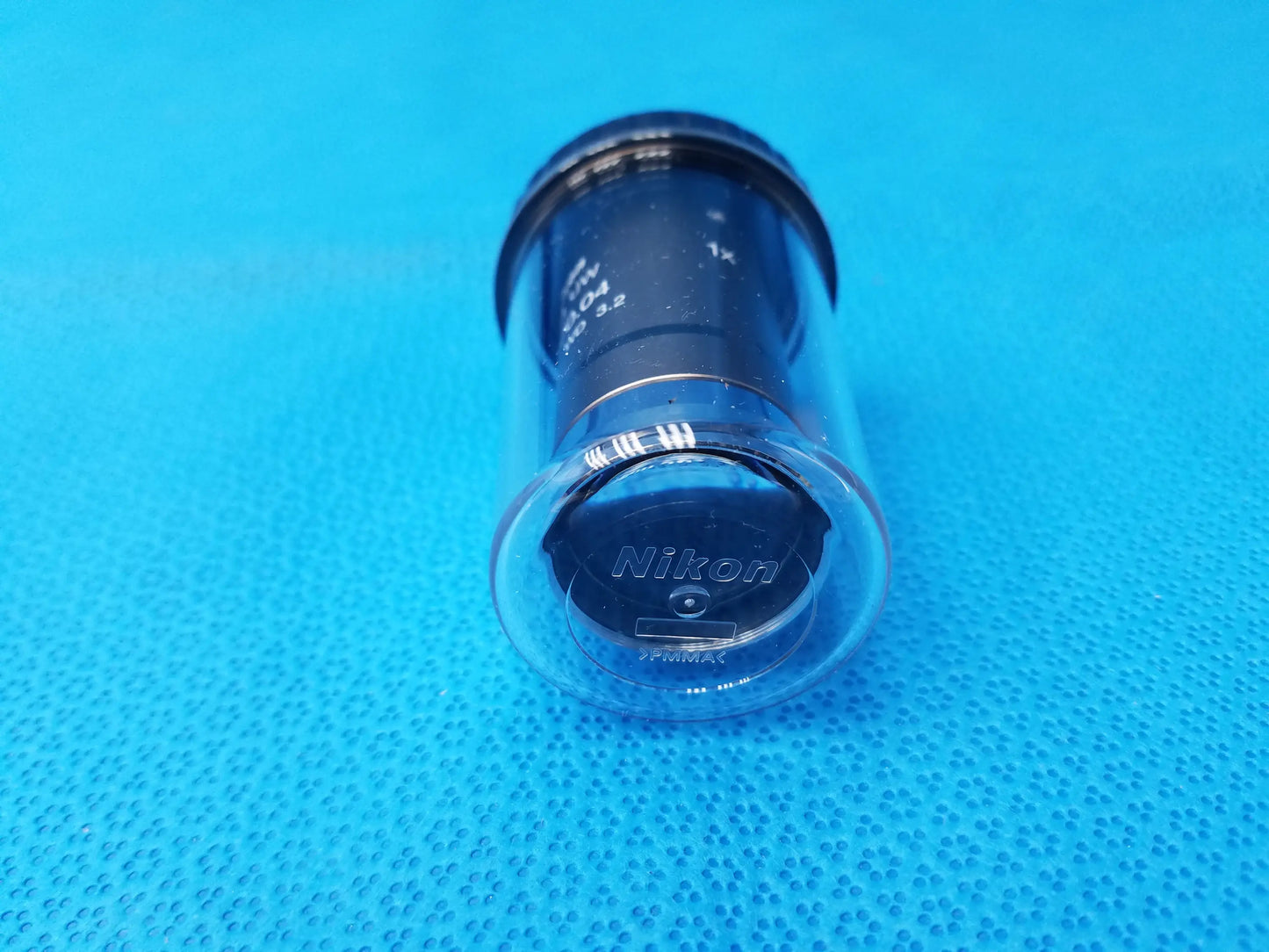 Nikon plan UW 1x microscope objective with clear plastic body and black interior compatible with Nikon microscope systems