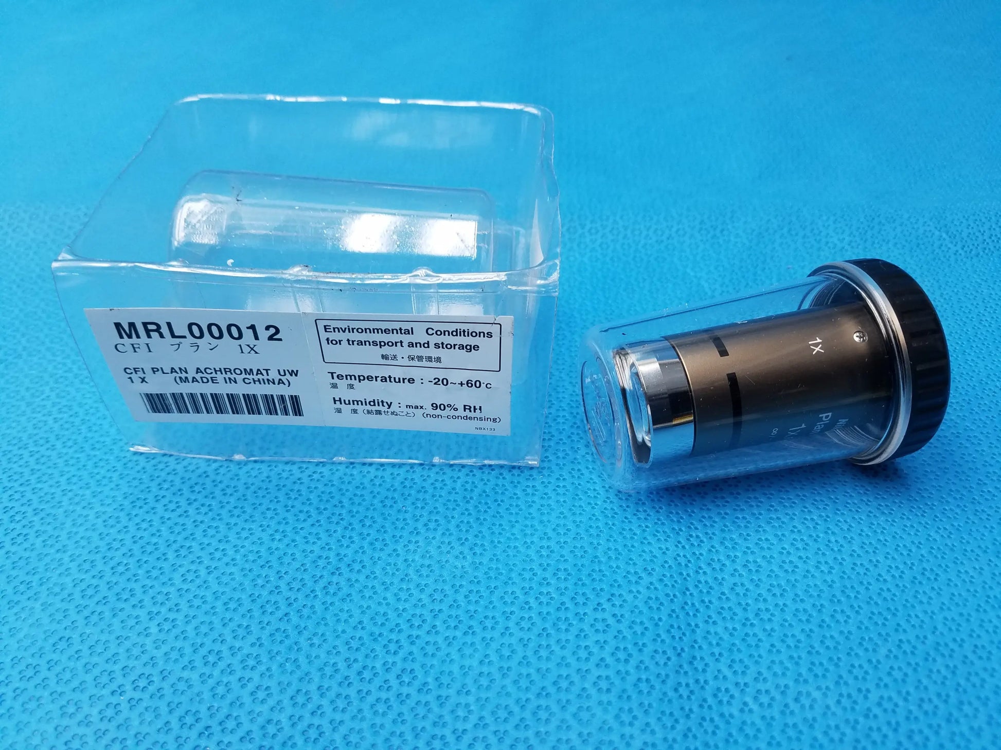 Metallic microscope objective lens with black cap and silver ring labeled cfi plan achromat uw 1x for compatible nikon microscope systems