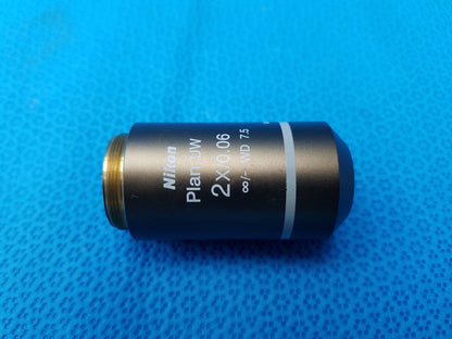 Nikon Plan UW 2x/0.06 microscope objective with matte black body gold threaded mount numerical aperture 0.06 working distance 7.5