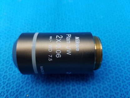 Nikon Plan UW 2x microscope objective with matte black body gold threaded mount 0.06 numerical aperture 7.5mm working distance