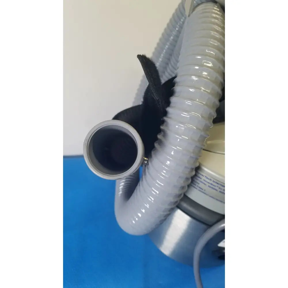 Gray corrugated hose with metallic silver end cap and black fabric strap for nilfisk advance hovermatt air supply unit