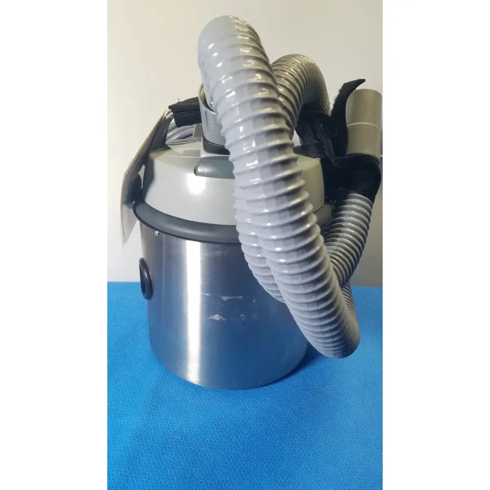 Gray and stainless steel nilfisk advance hovermatt air supply portable vacuum cleaner with corrugated hose 800w power