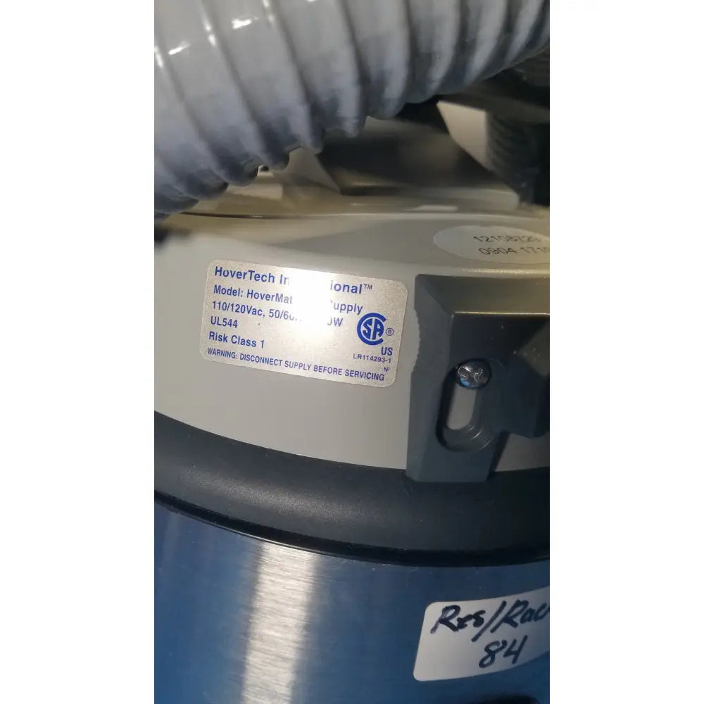 Gray and blue nilfisk hovermatt air supply unit industrial vacuum cleaner with hovertech international label visible