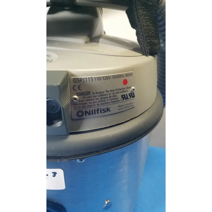Gray plastic nilfisk hovermatt air supply unit gspj115 industrial vacuum cleaner with blue cylindrical dust container