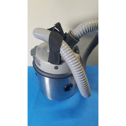 Gray and silver nilfisk hovermatt air supply unit with flexible corrugated hoses portable vacuum cleaner 800w