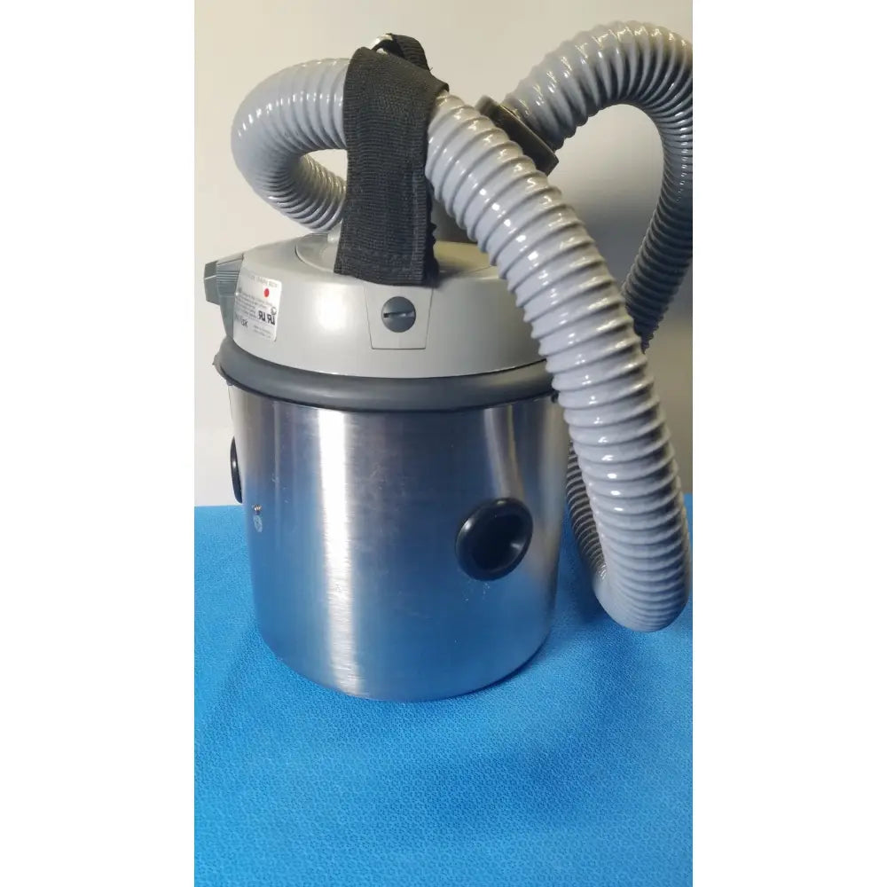 Gray and stainless steel nilfisk hovermatt air supply unit with flexible corrugated hoses for industrial vacuum cleaning