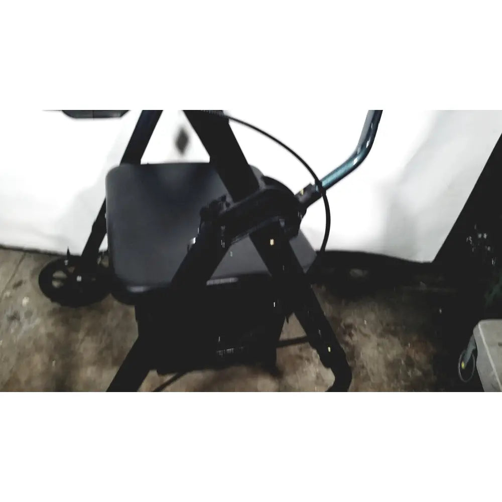 Black metal nova lightweight transport chair with padded seat and 12 inch rear wheels for 300lbs capacity