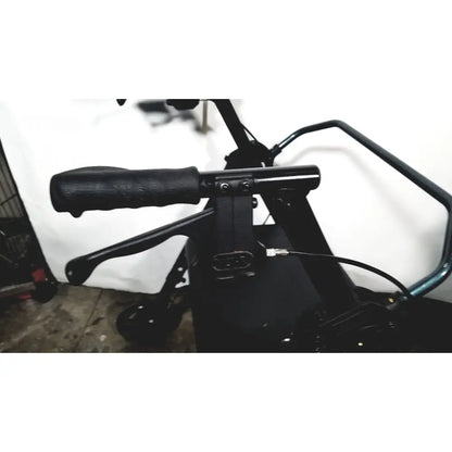 Black ergonomic handlebar grip with textured surface and metallic hardware on nova lightweight transport chair