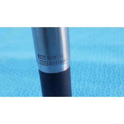Silver cylindrical novadaq sc9104 autoclavable laparoscope endoscope with black grip and engraved serial markings