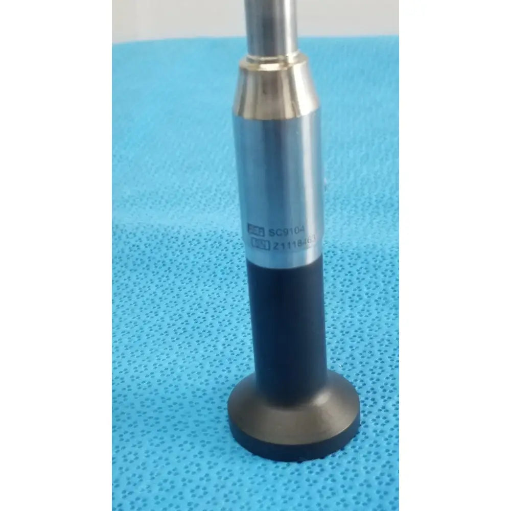 Silver and black novadaq sc9104 autoclavable laparoscope endoscope with cylindrical metallic shaft labeled sc9104