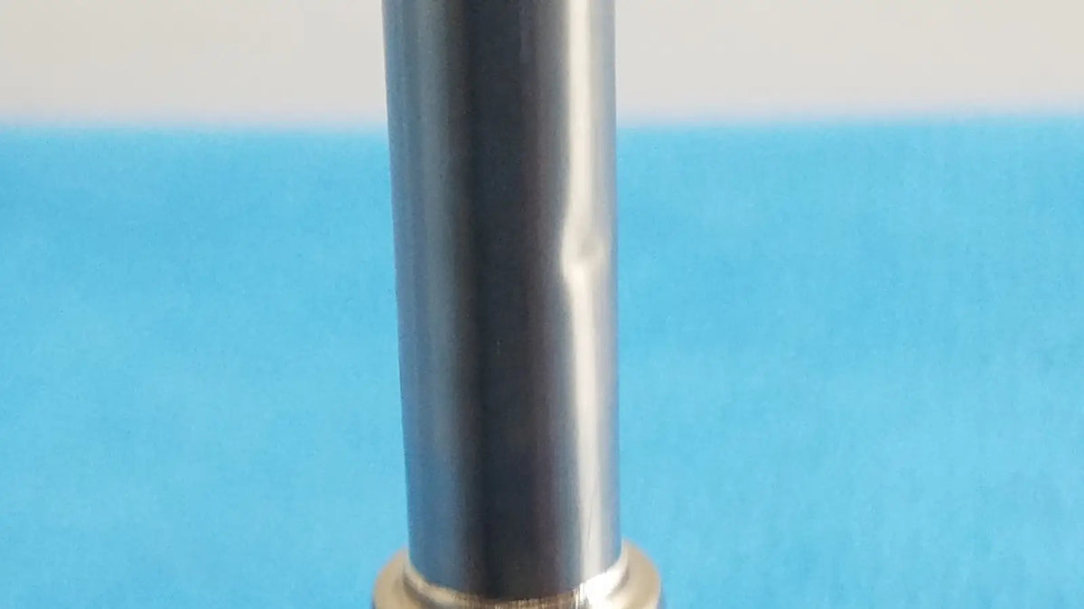 Novadaq sc9104 autoclavable laparoscope endoscope with a sleek silver cylindrical body and gold-toned base