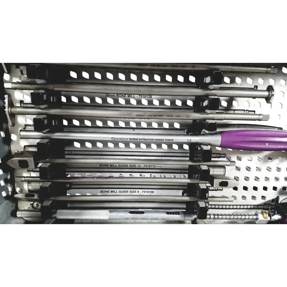 Purple-handled neurasys screw extractor with metallic shaft and engraved labeling from nuvasive speed innovation coroent xl-fixation tray